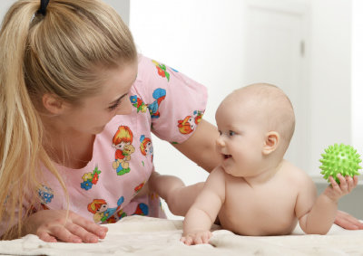 a woman entertaining a kid