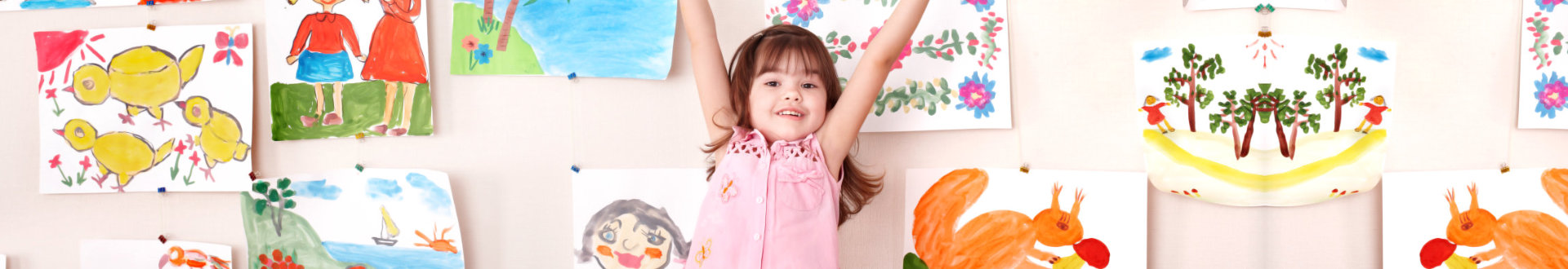 a happy kid raising her hands